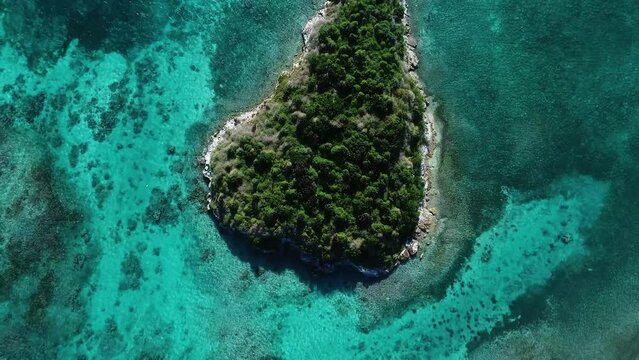 Small reef islands and coastal reefs in bright sunny day. Aerial view