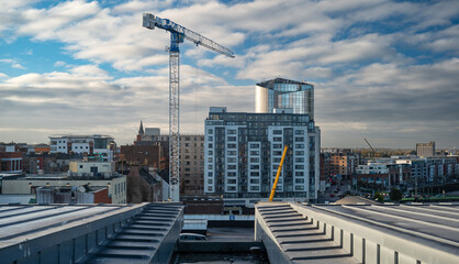 Construction crane over Limerick city skyline.