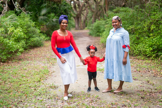 Women and child walking in the park