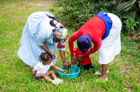 Woman making herbal bath for children