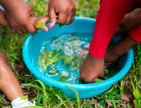Woman making herbal bath for children