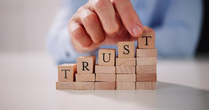 Man's Hand Placing Last Alphabet