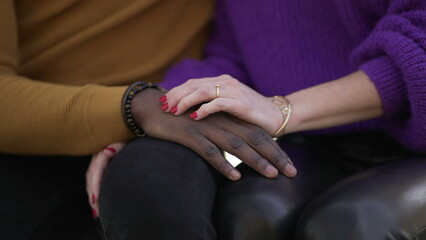 Fototapeta na wymiar Girlfriend hand caressing boyfriend. Interracial diverse couple, close-up hands
