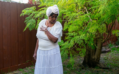 Elder Caribbean woman in all white