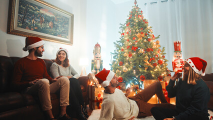 Happy Family Plays Under Christmas Tree