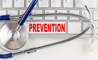 PREVENTION text on keyboard with stethoscope , medical concept - obrazy, fototapety, plakaty