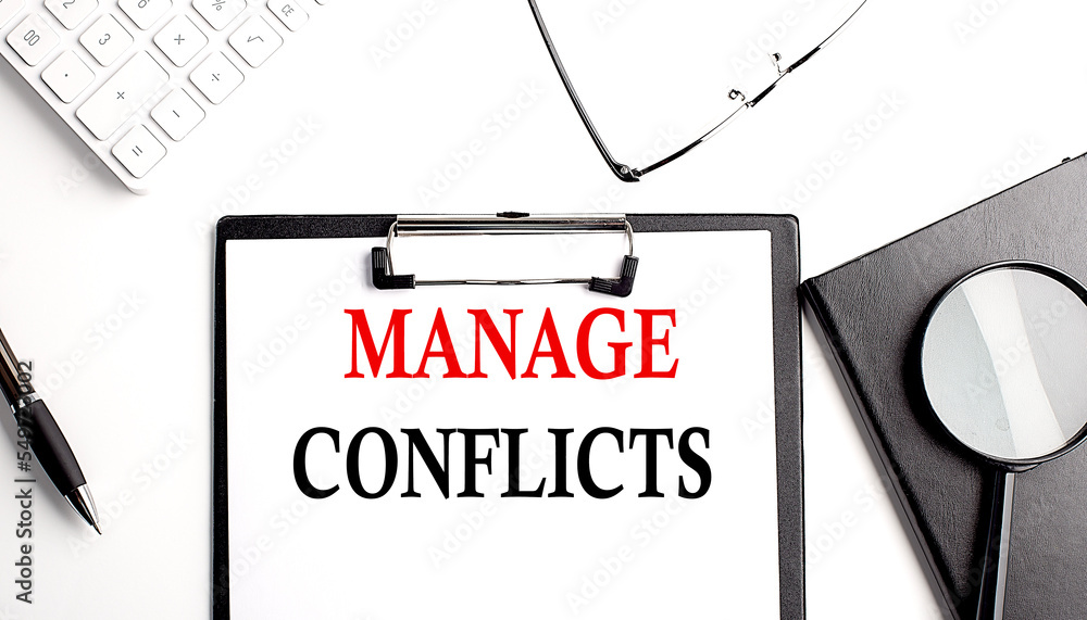 Poster manage conflicts text on white paper. the inscription on the notebook