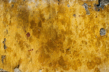 Distressed yellow and brown paint background