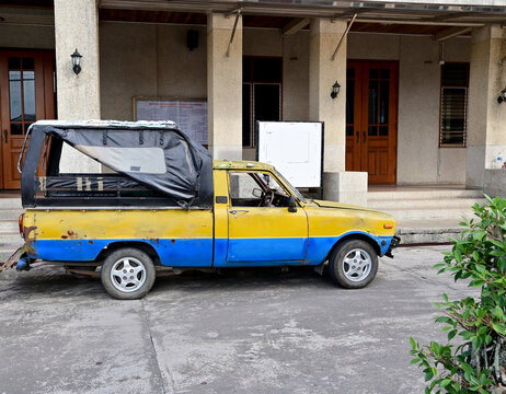 CHANTHABURI, THAILAND - December 15, 2022: Mazda Passenger Car Pick Up Truck With Roof To Cover The Rain Loading Stuff Is Parked In Front Of The Building