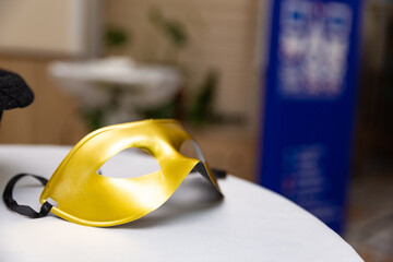 Golden mask on a white table