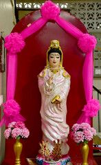 BANGKOK, THAILAND : NOVEMBER 28, 2022 - The White Guan Yin Statue is the Bodhisattva of Mahayana Buddhism standing in a beautiful chinese shrine at Thailand.