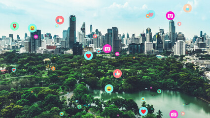Social media icons fly over city downtown showing people reciprocity connection through social...