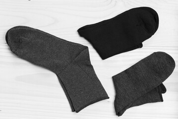 Several pairs of male socks flat lay isolated