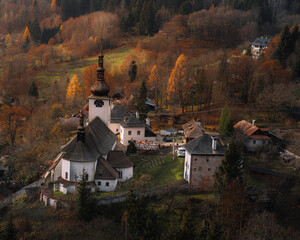 Church in The Spania Dolina village with mining landscape. 
 - obrazy, fototapety, plakaty