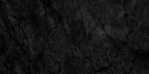 Ancient and grainy Black Emperador marble texture with various cracks, dusty and cracked old wall texture, dark black and grainy Concrete floor or old grunge, old blackboard or chalkboard texture.