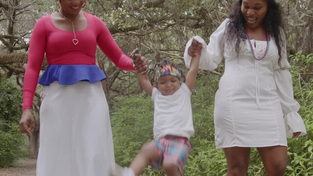 Woman playing with toddler in park
