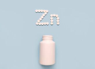 Chemical element Zinc Zn icon from tablets and drug bottle on blue background. Colltction of vitamin and minerals