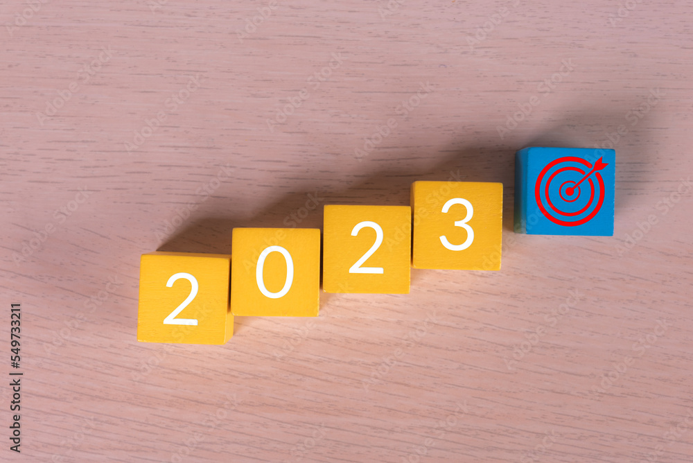 Aufkleber row of wood cube with text new year 2023 target