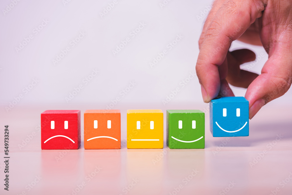 Poster hand build row of smile wood cube building block , customer satisfaction concept