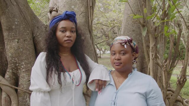 Two young ladies in nature with headwraps