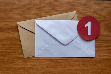 Concept of new email reminder or message alert. A white envelope with a red symbol of notification...