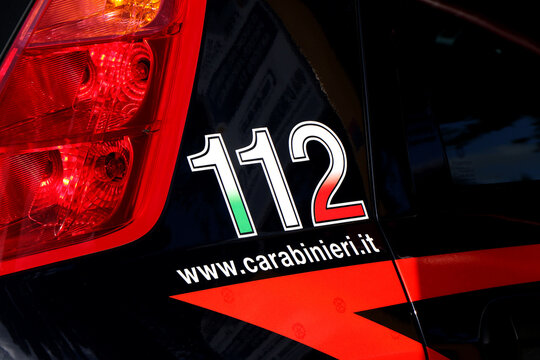 Side of an Italian Carabinieri car with emergency number 112 and website. Puglia, Italy