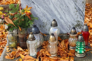 Lanterns on the tombstone in the public cemetery
