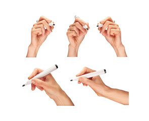 Female, women's hands holding a black marker pen as if writing a message isolated against a...