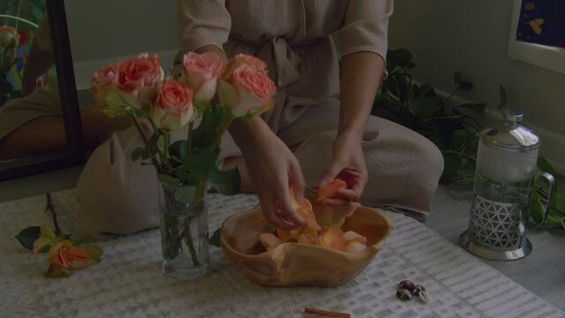 Young woman making floral hand wash