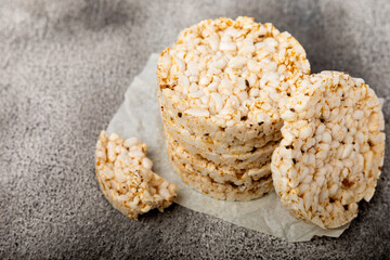 Rice cakes on a black table. Bread. Airy rice bread. dietary crispy round rice cakes. Place for text. Place to copy. Healthy food. dietary product.