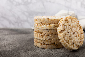 Rice cakes on a black table. Bread. Airy rice bread. dietary crispy round rice cakes. Place for...