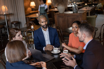 Group of businesspeople having a meeting in a restaurant