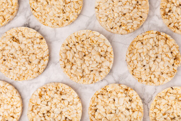 Rice bread on a marble background. Rice cakes. Diet bread on the table.Healthy food without yeast.Place for text. Place to copy. Healthy food. dietary product.