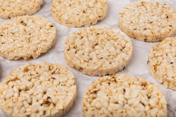 Rice bread on a marble background. Rice cakes. Diet bread on the table.Healthy food without yeast.Place for text. Place to copy. Healthy food. dietary product.