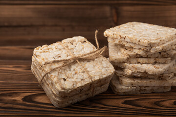 Rice bread on a brown background. Rice cakes. Diet bread on the table.Healthy food without yeast.Place for text. Place to copy. Healthy food. dietary product.