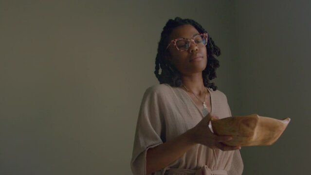 Young woman enjoying moment of presence and dancing 