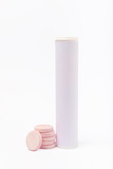 Colored medical pills pouring out of a medicine bottle isolated on a white background. Vitamins. Health concept. Immunity drug. Space for copy. Space for text.