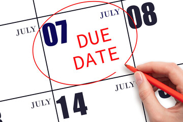 7th day of July. Hand writing text DUE DATE on calendar date July 7 and circling it. Payment due...