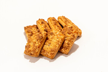 A stack of homemade cookies with apricot jam on a white background.