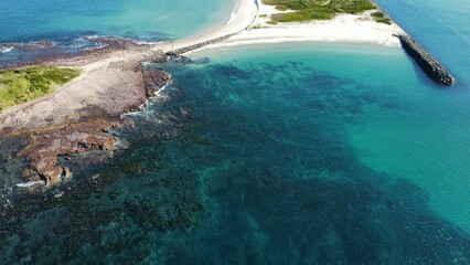 Bird's-eye view of water covering the Windang Islands' shores