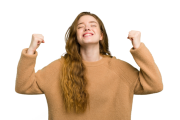 Young caucasian redhead woman isolated celebrating a victory, passion and enthusiasm, happy expression.
