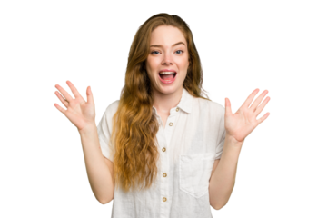 Young caucasian redhead woman isolated receiving a pleasant surprise, excited and raising hands.