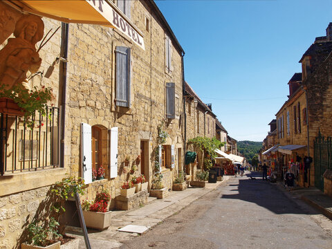 Majestic Bastide of Domme, medieval town of Périgord Noir - Shopping and quiet narrow street with traditional perigordian yellow stone houses, most medieval architecture