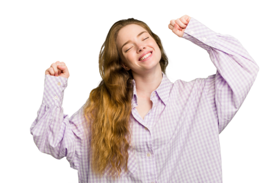 Young caucasian redhead woman isolated celebrating a special day, jumps and raise arms with energy.