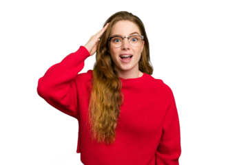 Young caucasian redhead woman isolated shouts loud, keeps eyes opened and hands tense.