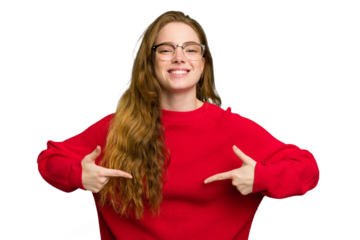 Young caucasian redhead woman isolated person pointing by hand to a shirt copy space, proud and confident