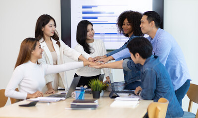 Startup business meeting young entrepreneurs. Cooperation of colleagues and teamwork of people in the organization.