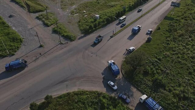 aerial view garbage trucks drive 