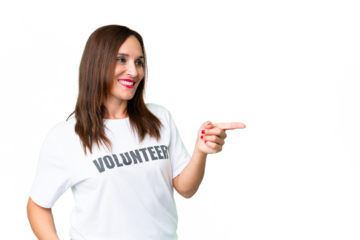 Middle age volunteer woman over isolated chroma key background pointing finger to the side and presenting a product