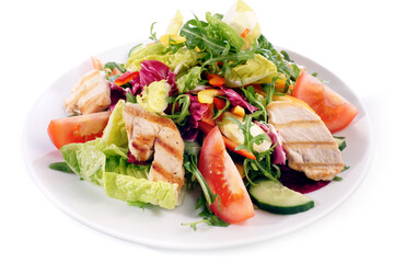Mixed Salad on a Plate with grilled Chicken isolated on white background